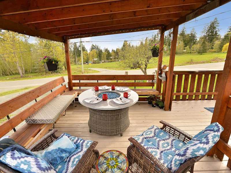 Spacious covered seating space on the deck with views.