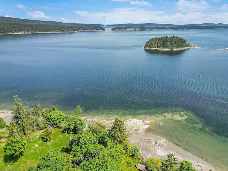 Drone aerial photo above the cottage facing the ocean.