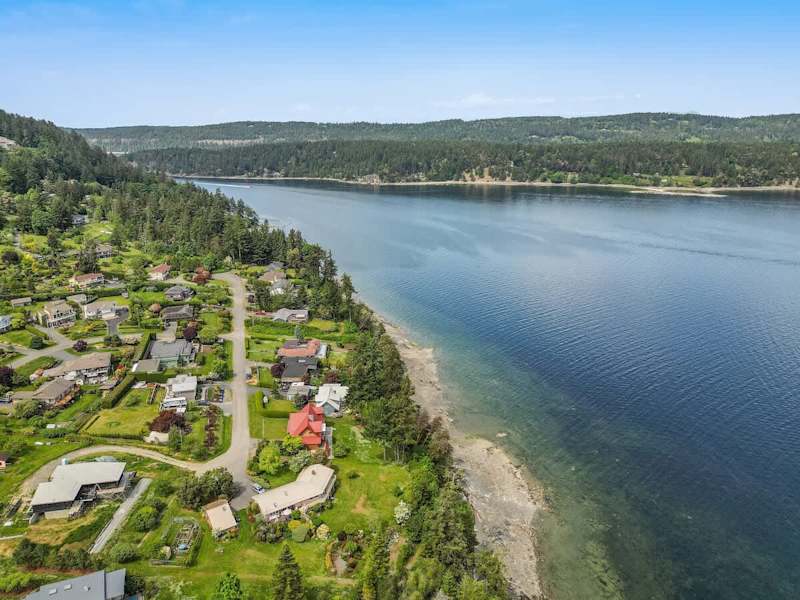 Drone aerial photo above the cottage facing the ocean.