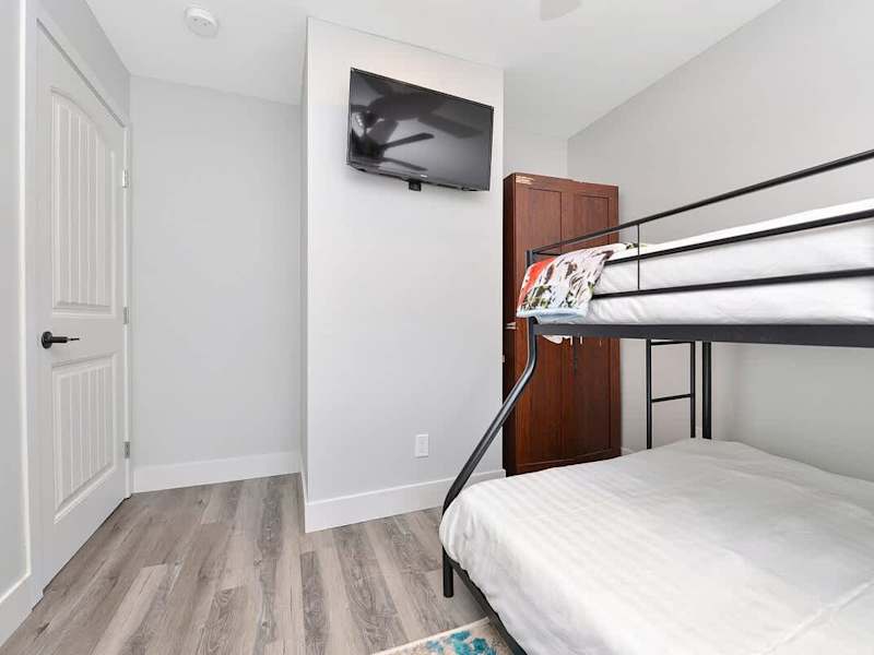 Second bedroom bunk beds with double and single up.
