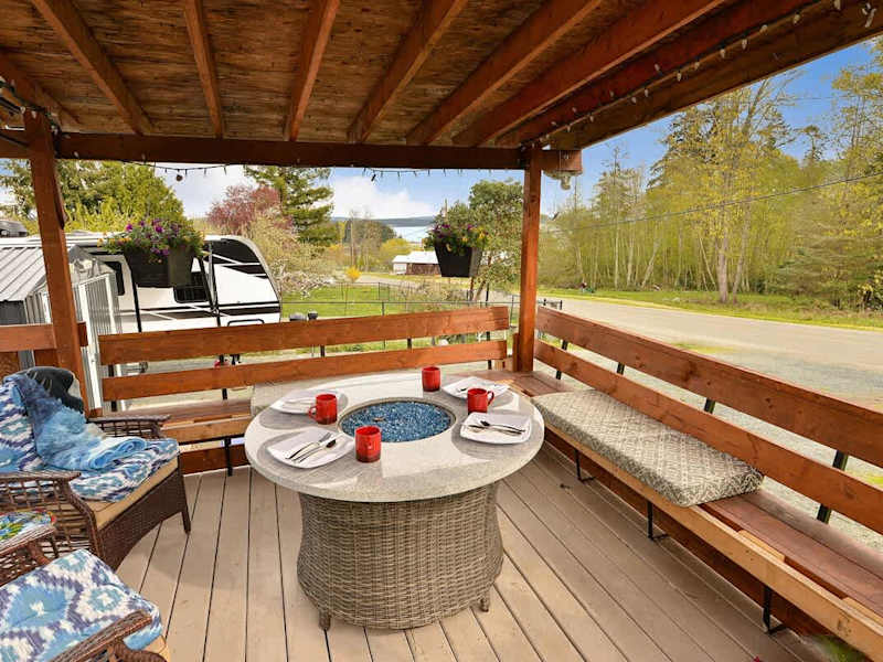 Spacious covered seating space on the deck with views.