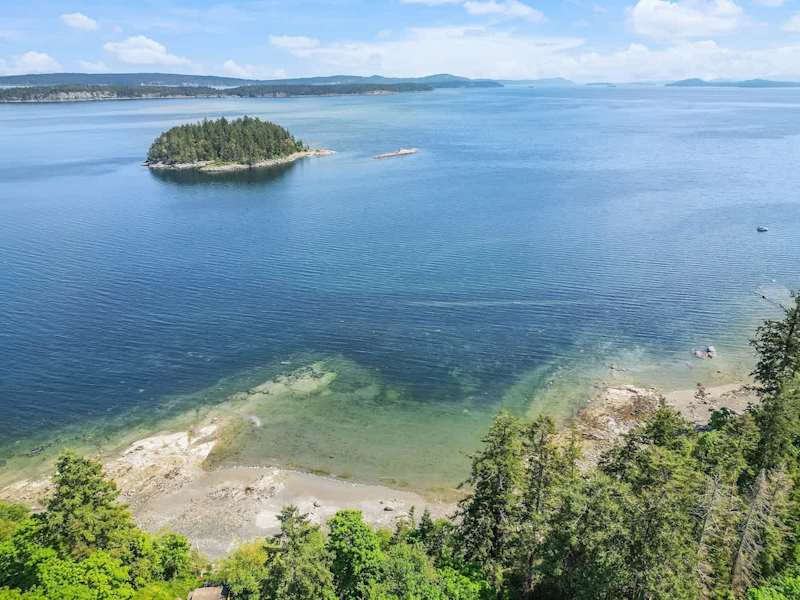 Drone aerial photo above the cottage facing the ocean.