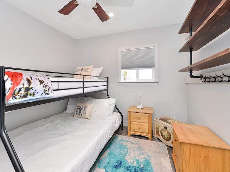 Second bedroom bunk beds with double and single up.