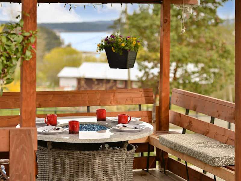 Spacious covered seating space on the deck with views.