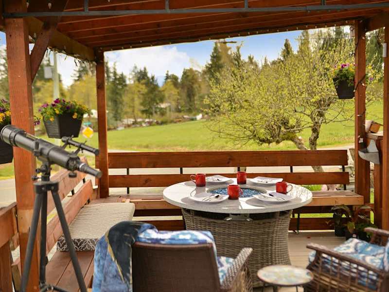 Spacious covered seating space on the deck with views.