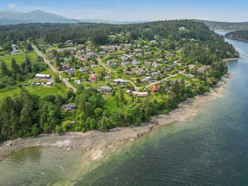 Drone aerial photo above the cottage facing the ocean.