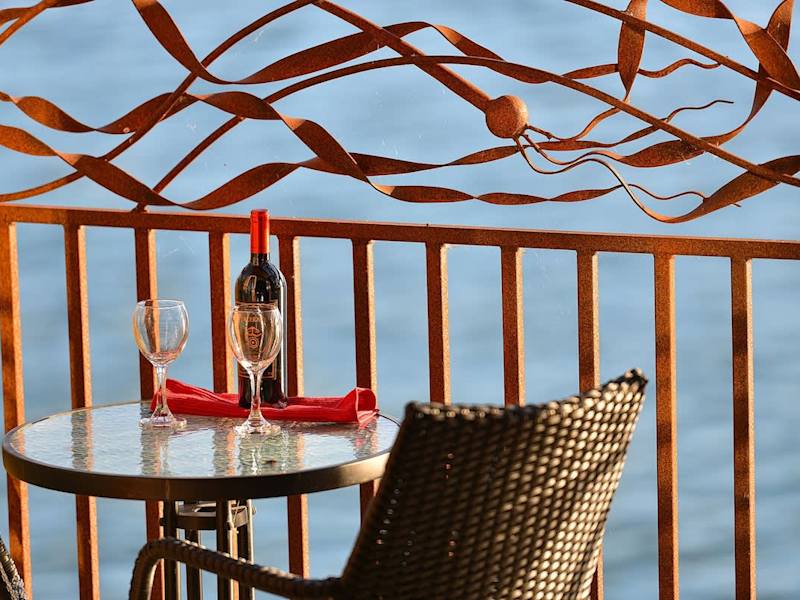 Private balcony with bistro set to enjoy the bayside experience.