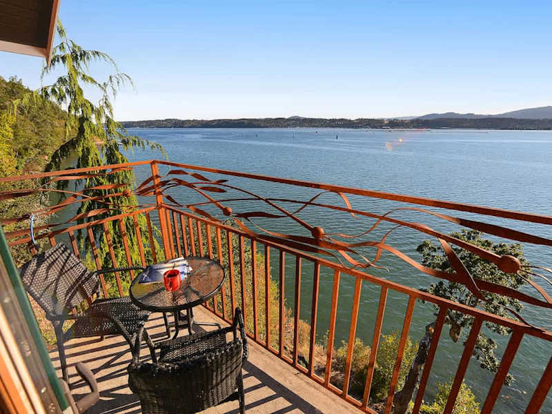 Primary bedroom private bay view balcony.