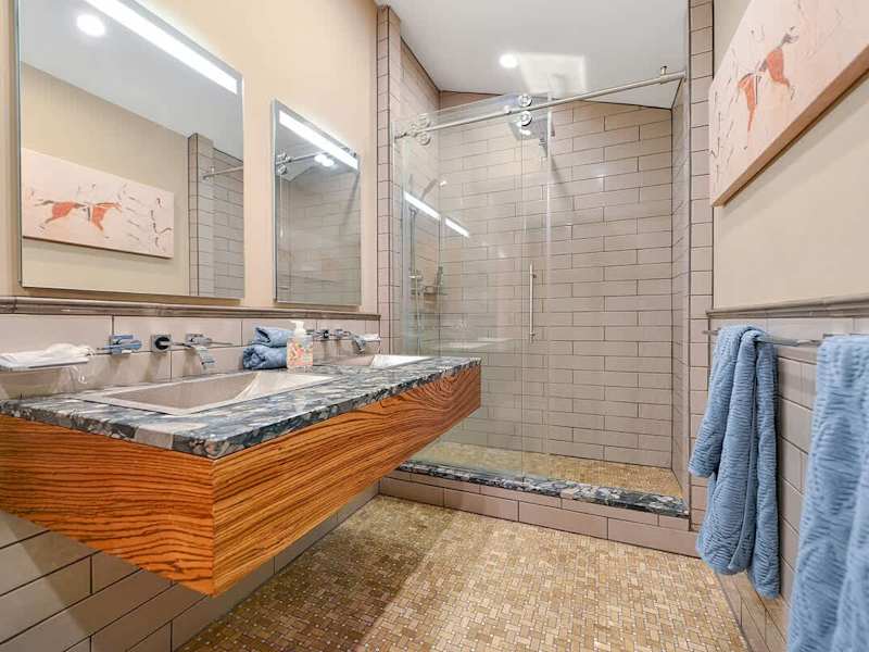 Dual sinks and walk in shower for the main bathroom.