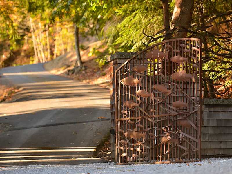 Main gates for the property showing ornate salmon metal work.