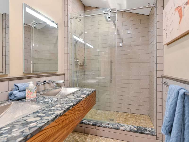 Dual sinks and walk in shower for the main bathroom.