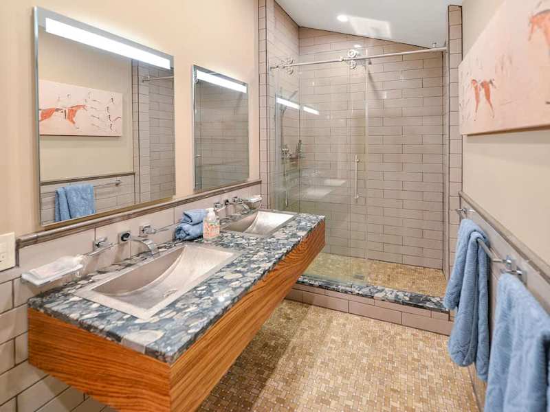 Dual sinks and walk in shower for the main bathroom.