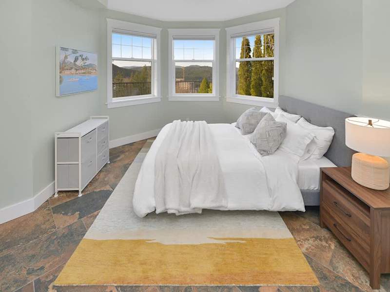 Lower floor sixth bedroom with queen bed.