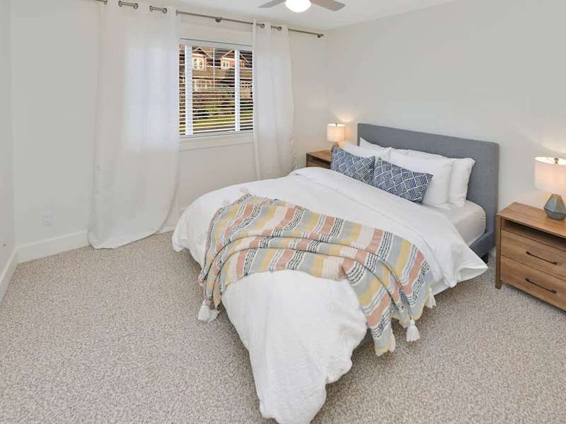 Top floor third bedroom with queen bed.