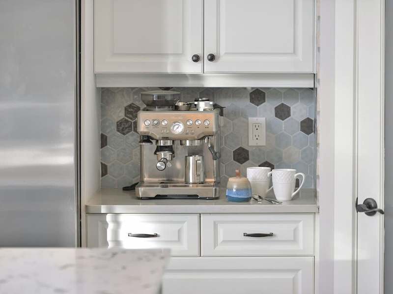 Fully equipped modern kitchen with amazing views on the main floor.