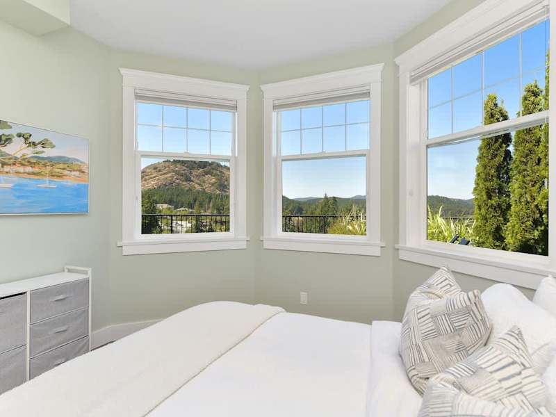 Lower floor sixth bedroom with queen bed.