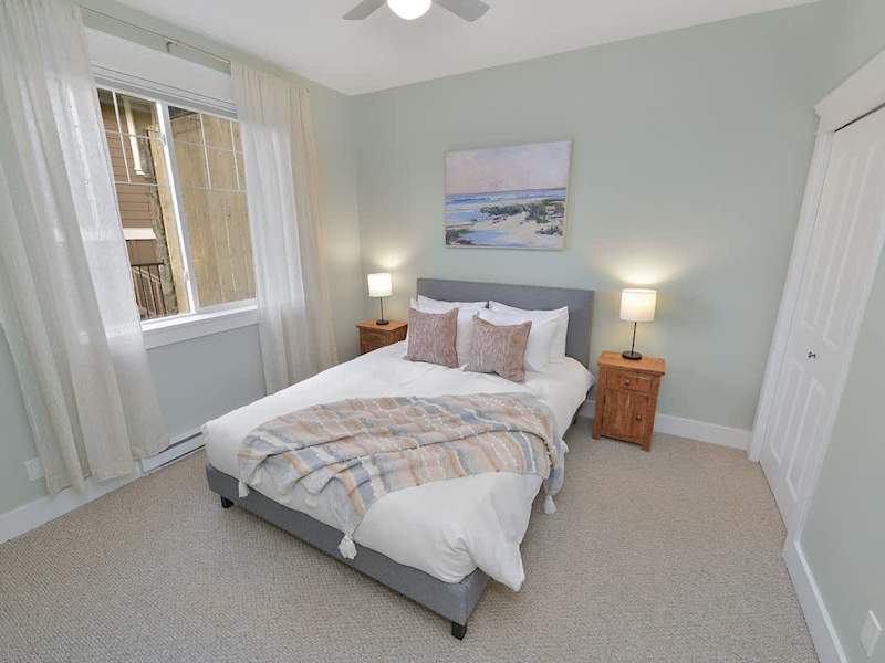 Lower floor fifth bedroom with queen bed.