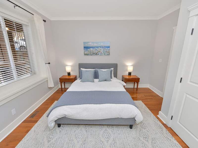 Main floor second bedroom. with queen bed.