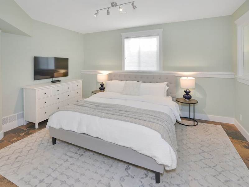 Lower floor seventh bedroom with king bed.