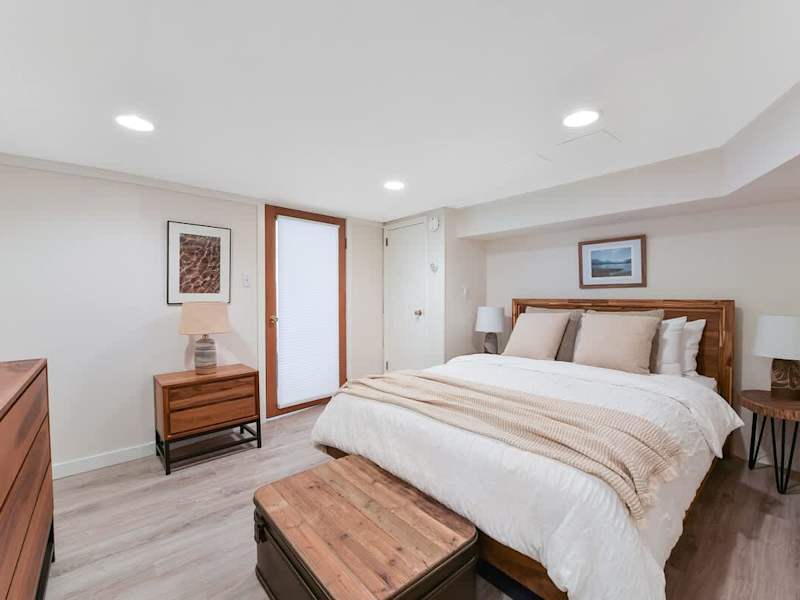 Den that acts as a second bedroom with queen bed.