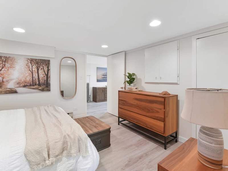Den that acts as a second bedroom with queen bed.