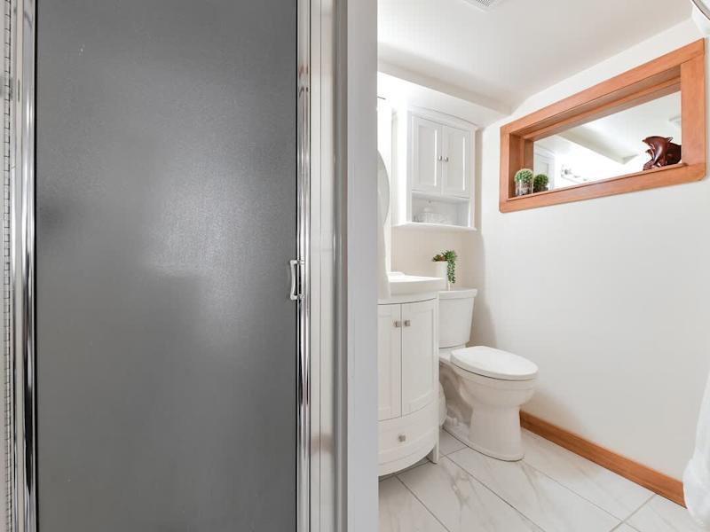 Bathroom with walk-in shower.