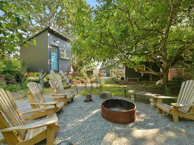 Backyard living and garden spaces. Please note that there is open burning bans seasonally thus the firepit use may not be available.