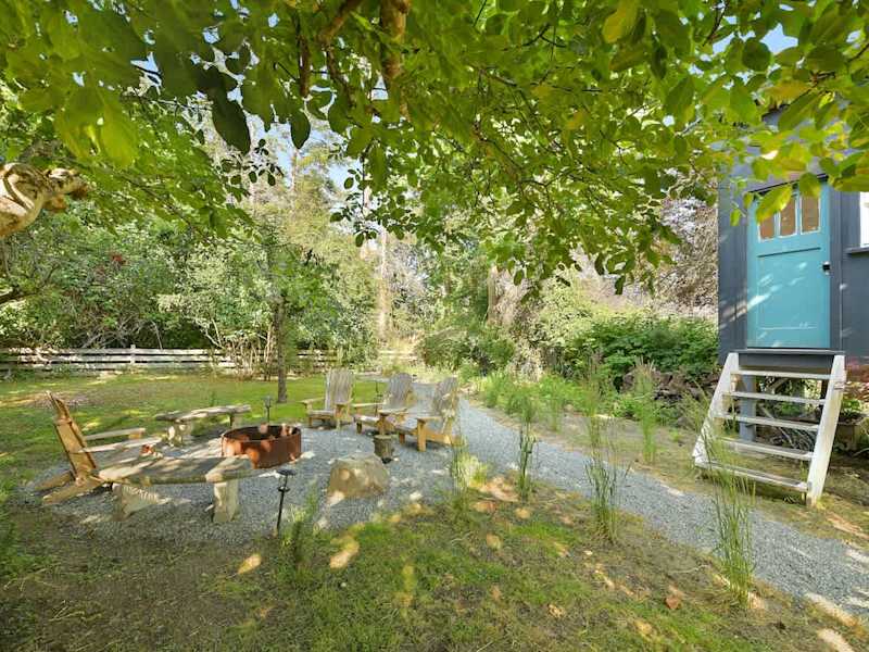 Backyard living and garden spaces. Please note that there is open burning bans seasonally thus the firepit use may not be available.