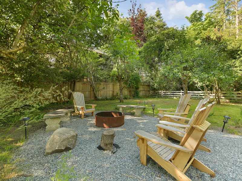 Backyard living and garden spaces. Please note that there is open burning bans seasonally thus the firepit use may not be available.