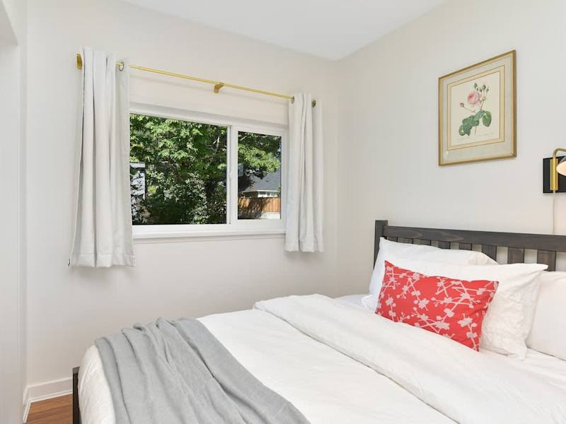 Second bedroom in the main cottage with two double beds.