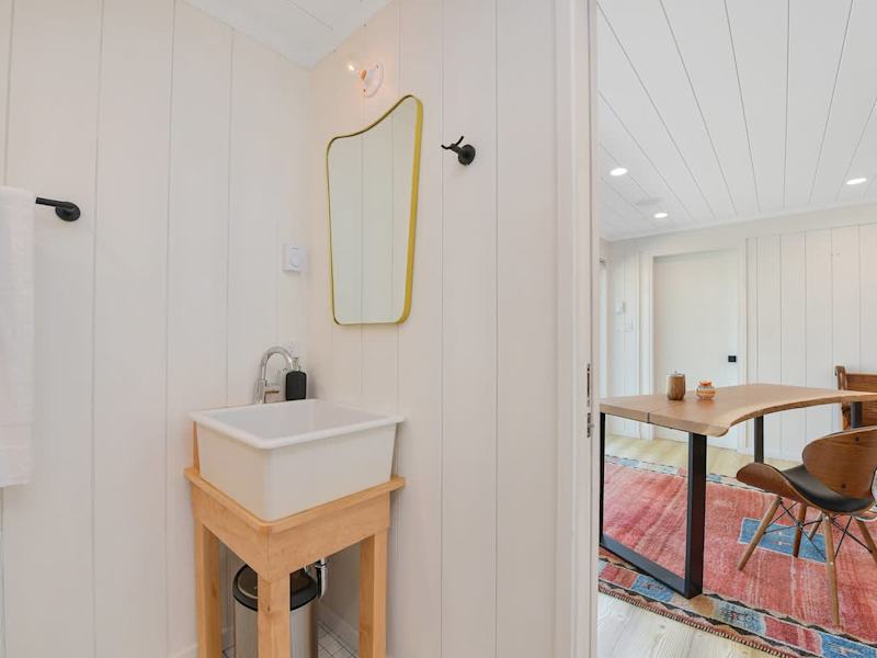 Inside the studio cottage with bathroom and office space.