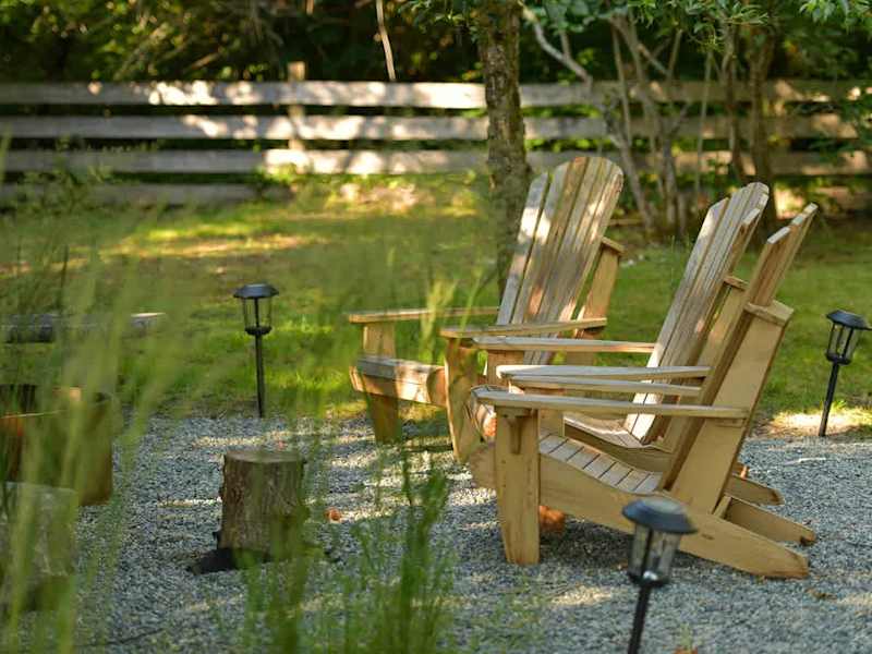 Backyard living and garden spaces. Please note that there is open burning bans seasonally thus the firepit use may not be available.