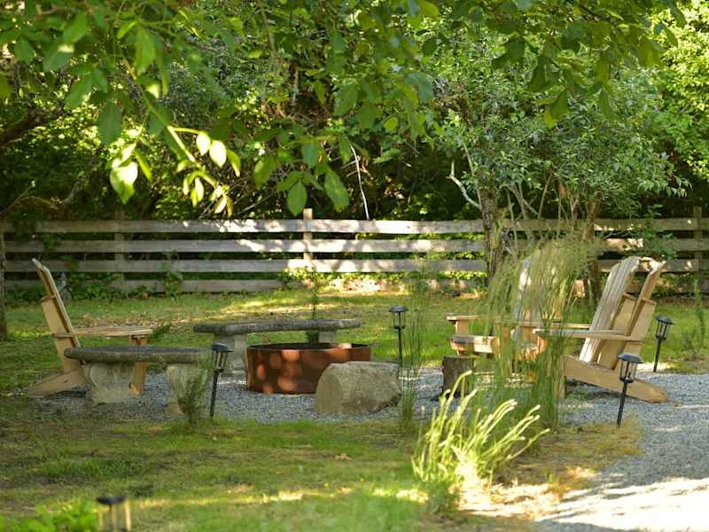 Backyard living and garden spaces. Please note that there is open burning bans seasonally thus the firepit use may not be available.