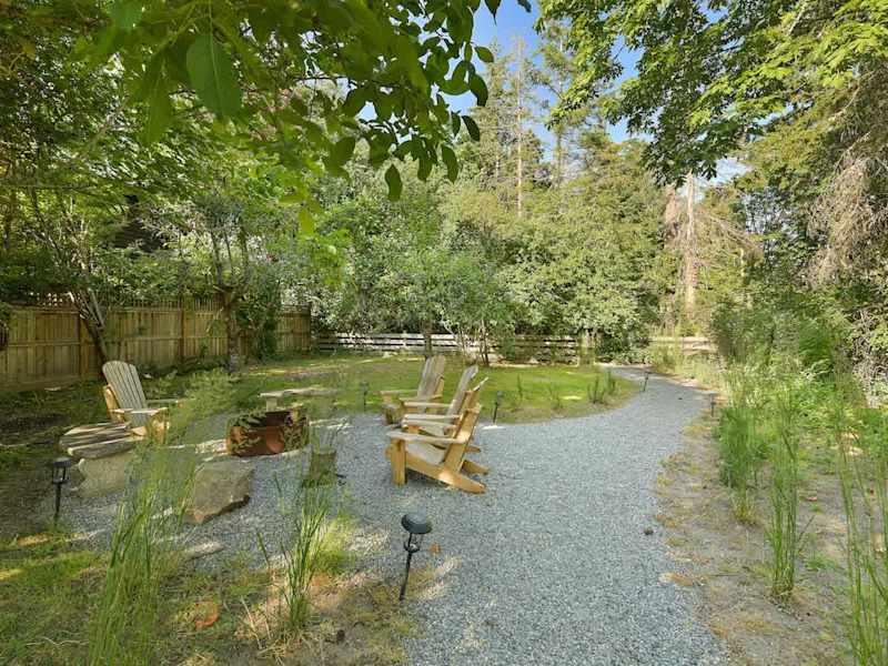 Backyard living and garden spaces. Please note that there is open burning bans seasonally thus the firepit use may not be available.