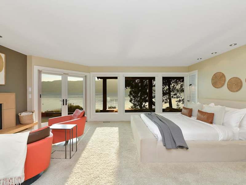 Immaculate primary bedroom with sweeping views and incredible ensuite.