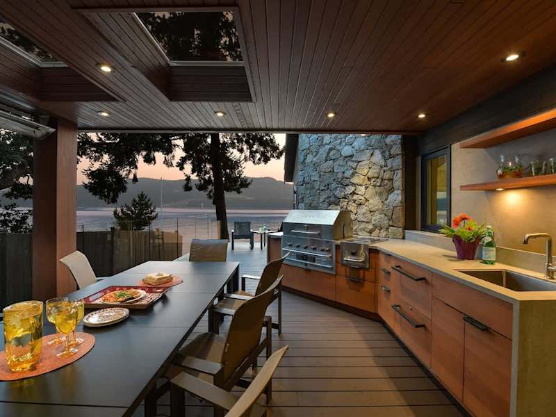 Outdoor deck dining space which is fully covered and can be used year round.