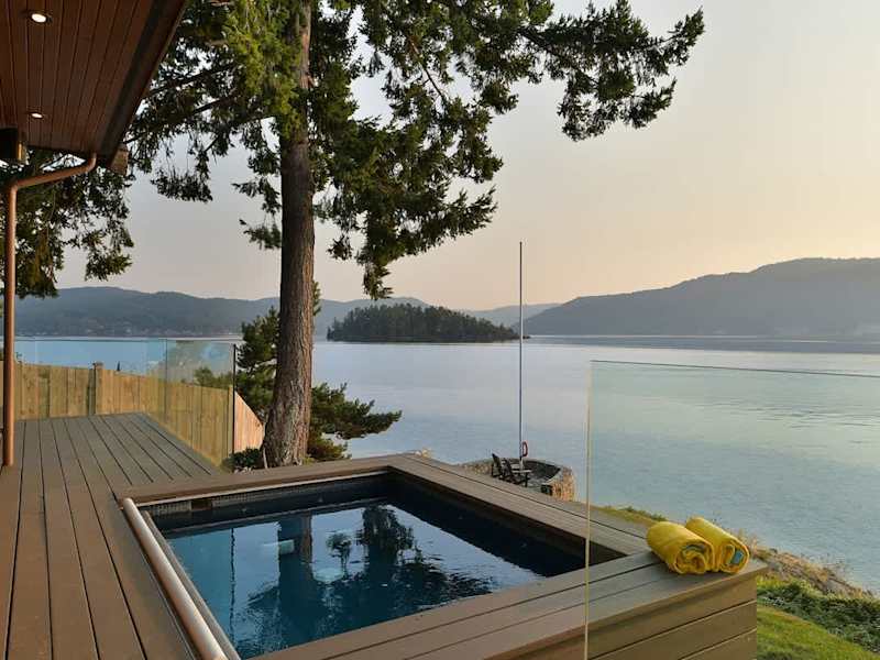 Incredible outdoor living spaces on the oceanside of the main house plus hot tub!