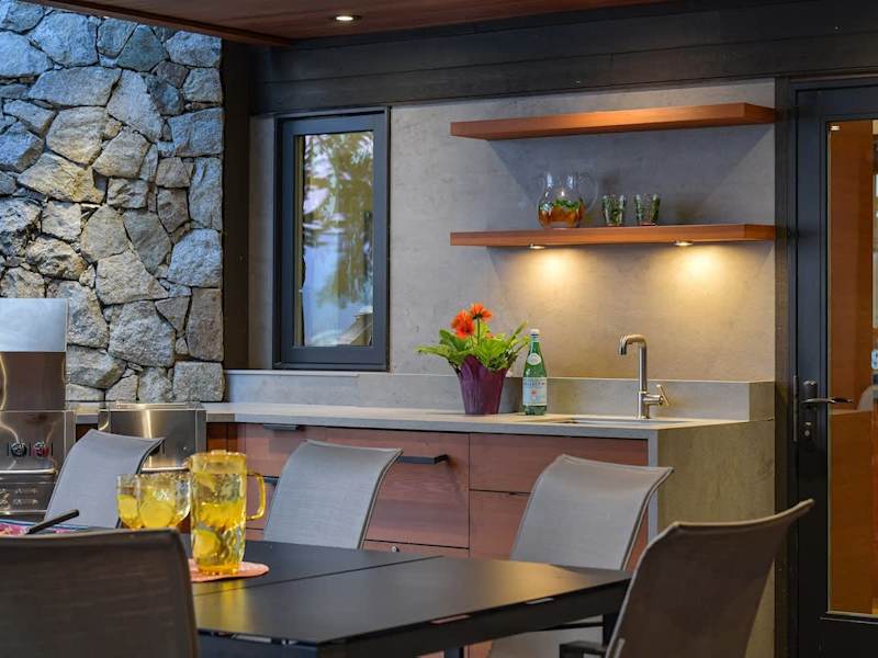 Outdoor deck dining space which is fully covered and can be used year round.