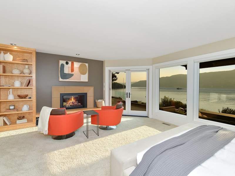Immaculate primary bedroom with sweeping views and incredible ensuite.