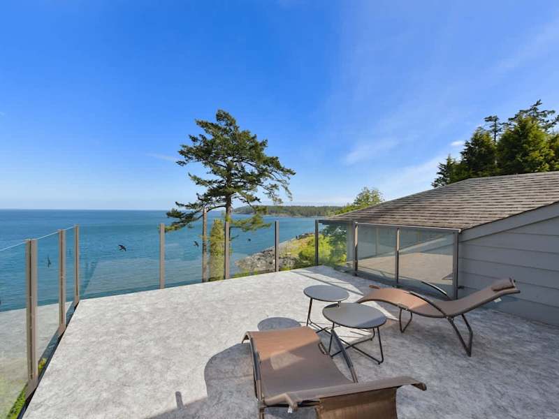 Primary bedroom suite on the top floor with king bed, private deck, living room and full ensuite with walk in closet.