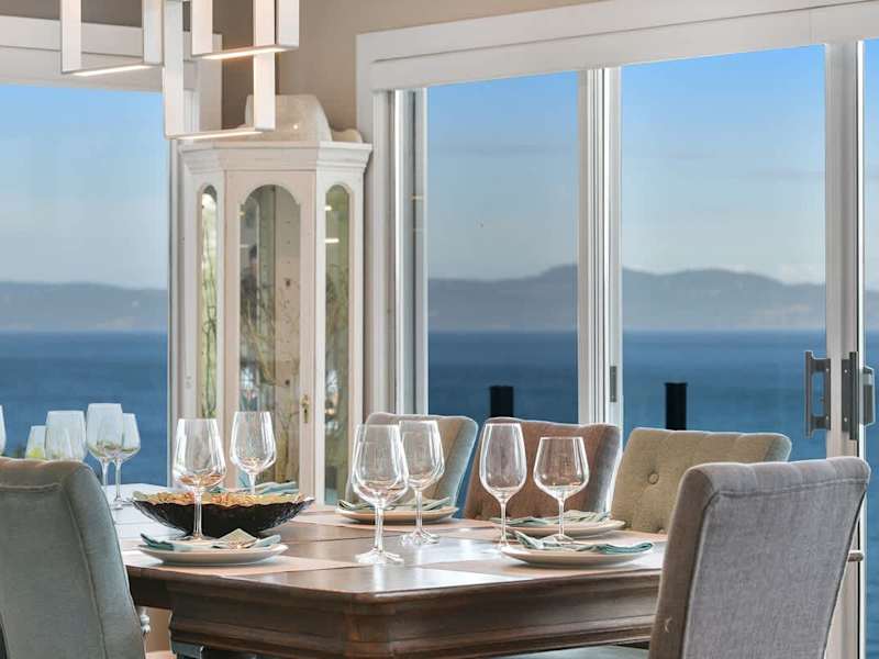 Dining room seats 8 with amazing views on the main floor.