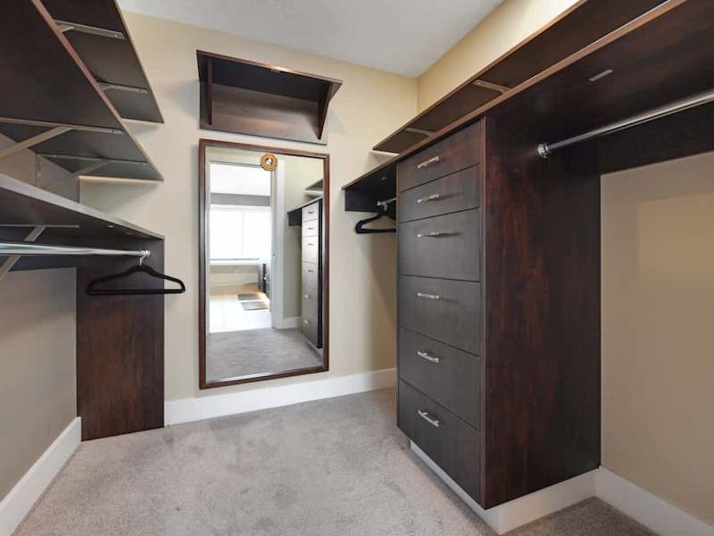 Primary bedroom suite on the top floor with king bed, private deck, living room and full ensuite with walk in closet.