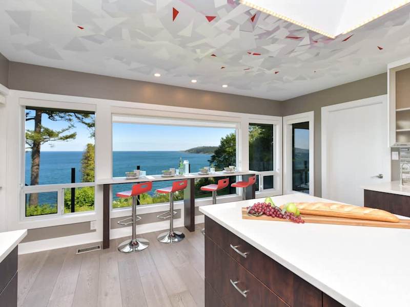 Well equipped and modern kitchen on the main level with amazing views of the ocean.
