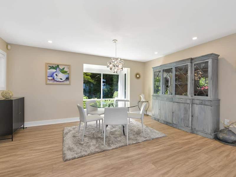 Second dining table space on the main floor with both garden and ocean views.