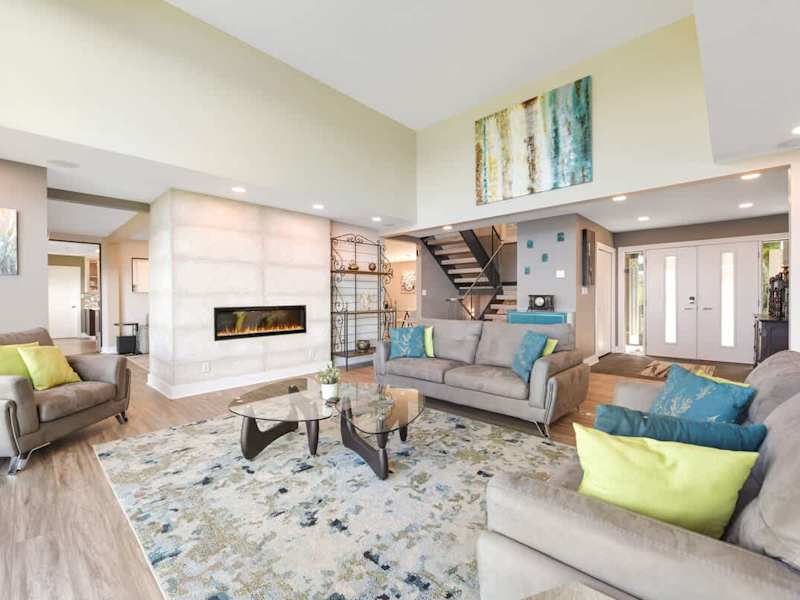 Main floor well appointed living room with spectacular views of the ocean and islands.