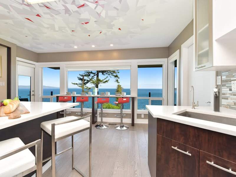Well equipped and modern kitchen on the main level with amazing views of the ocean.