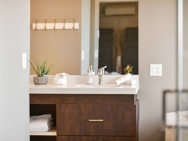 Primary bedroom suite on the top floor with king bed, private deck, living room and full ensuite with walk in closet.