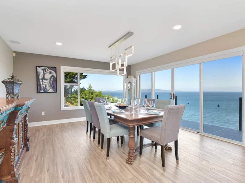 Dining room seats 8 with amazing views on the main floor.
