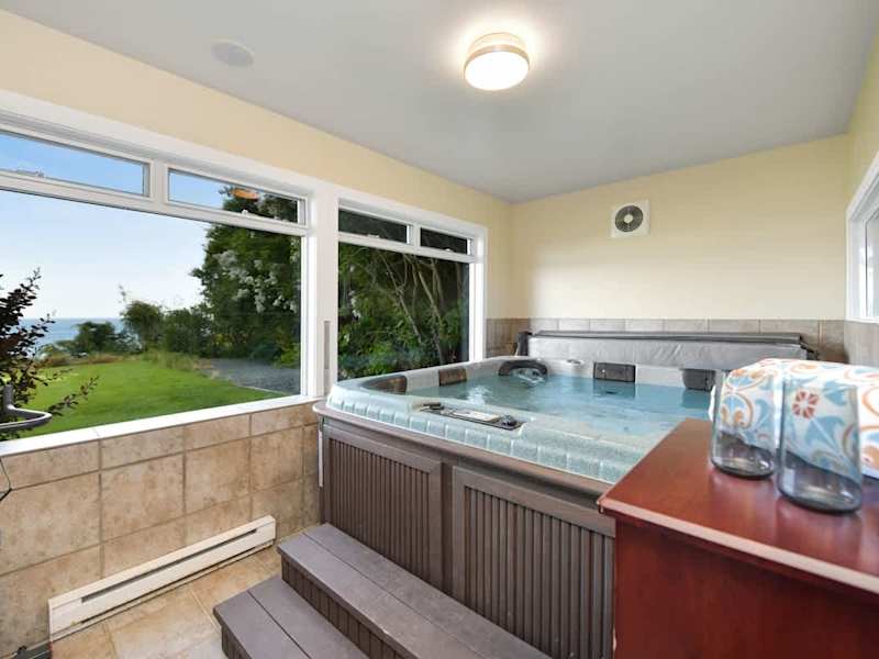 Indoor hot tub with amazing views in the ground floor.