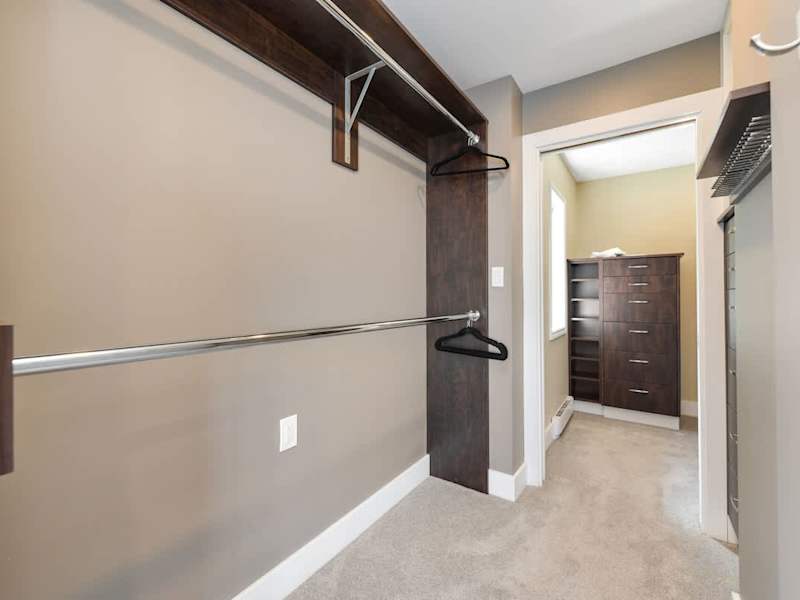Primary bedroom suite on the top floor with king bed, private deck, living room and full ensuite with walk in closet.